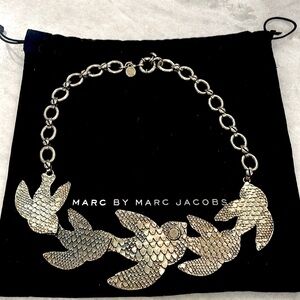Marc by Marc Jacobs silver colored large swallow necklace.